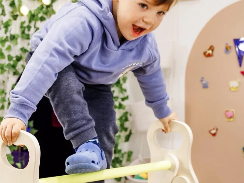 Parents enjoying coffee while children play safely