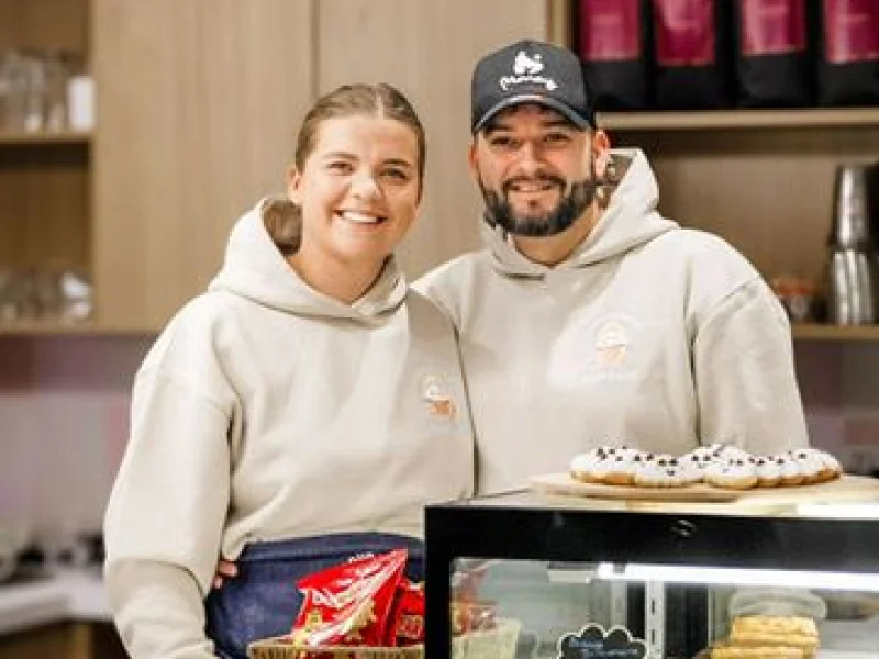 Parents enjoying coffee while children play safely