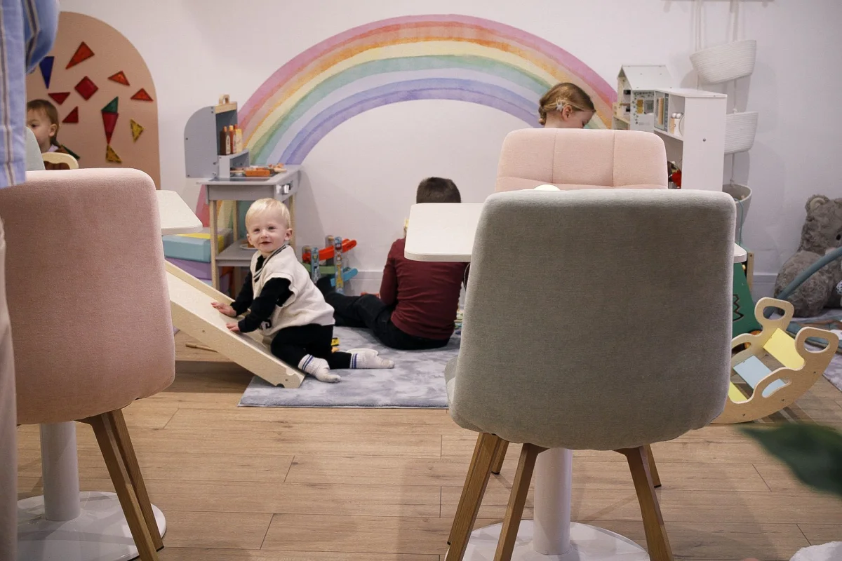 Parents connecting while children play together