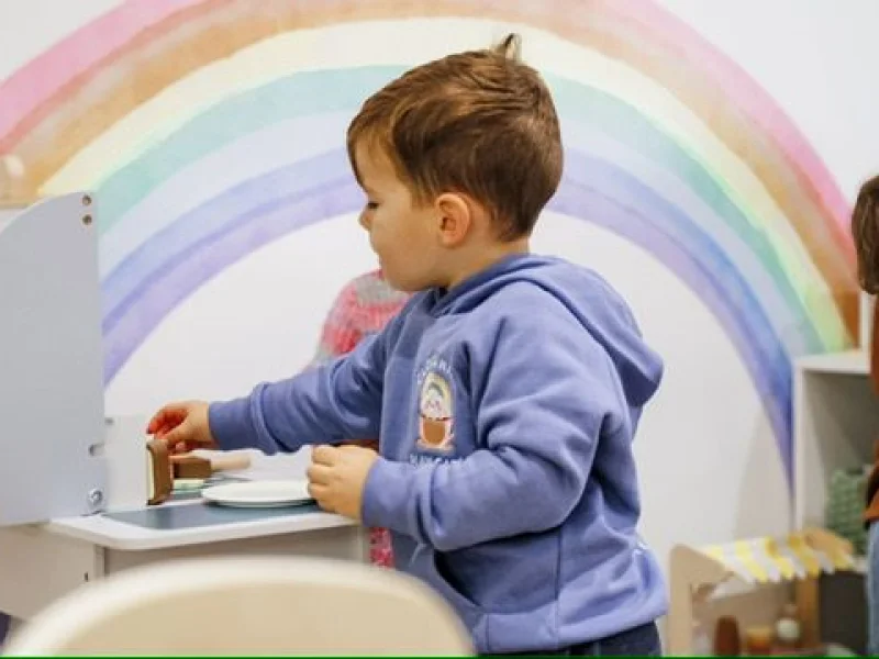 Parents enjoying coffee while children play safely